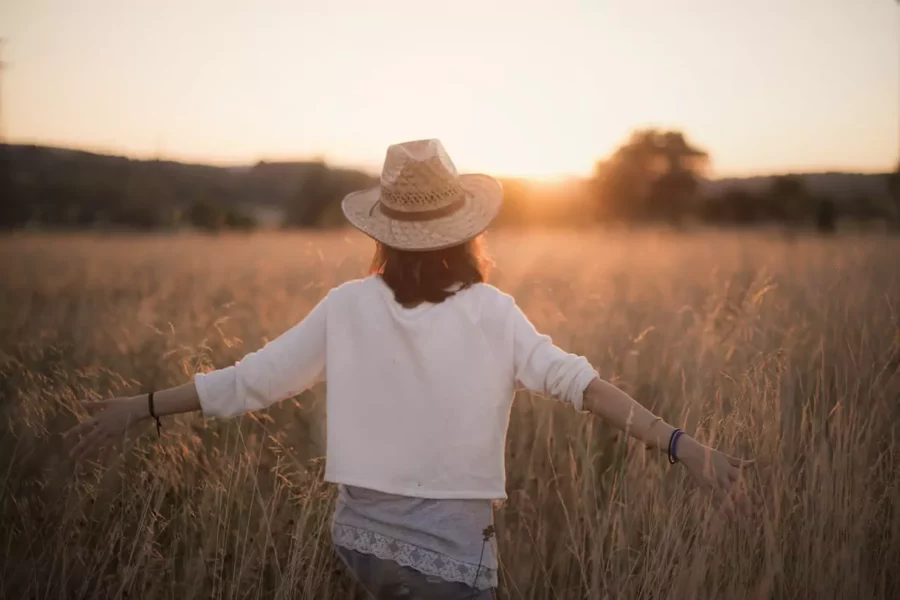 A hodophile walking through a field of grass