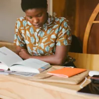 A woman using different learning styles to study