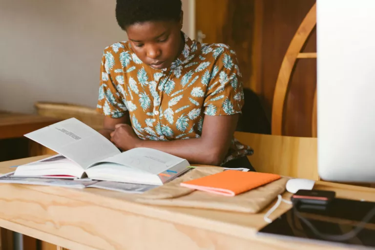 A woman using different learning styles to study