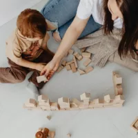 A child engaging in kinesthetic or tactile learning.