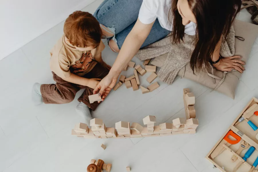 A child engaging in kinesthetic or tactile learning.