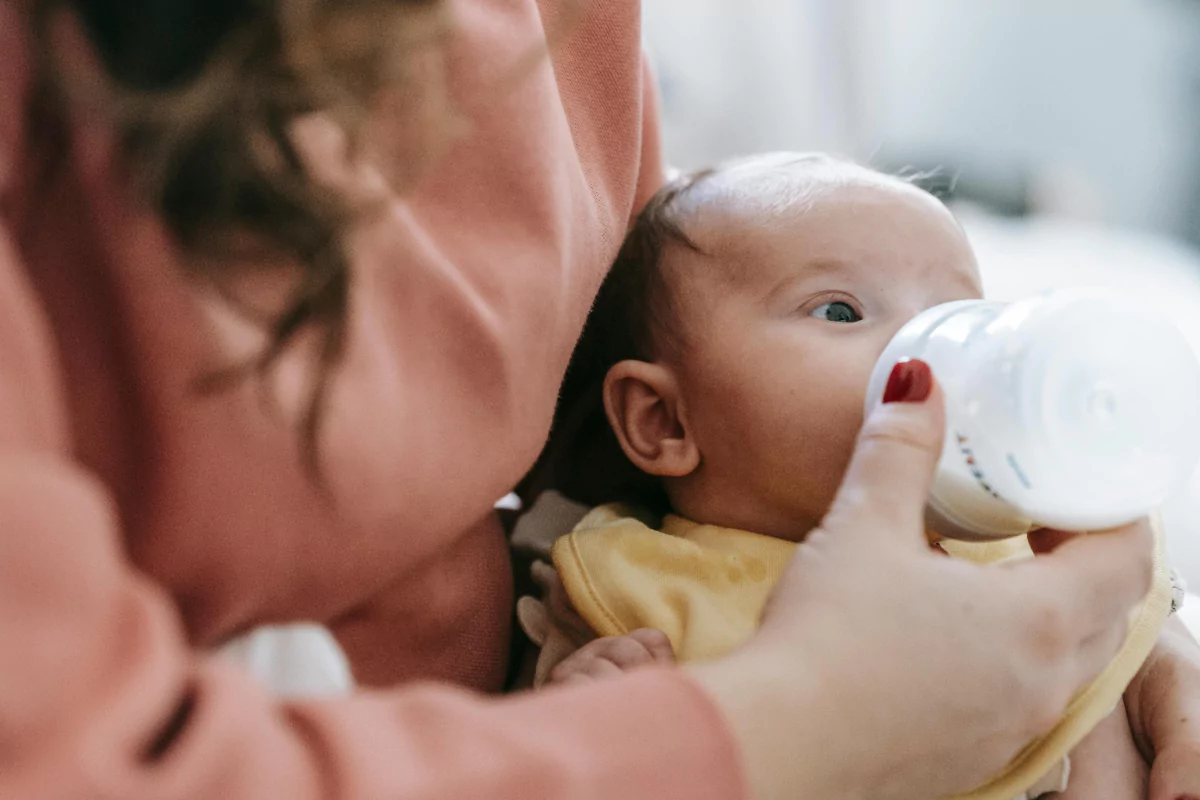 A mother showing care during the trust vs. mistrust stage of psychosocial development.